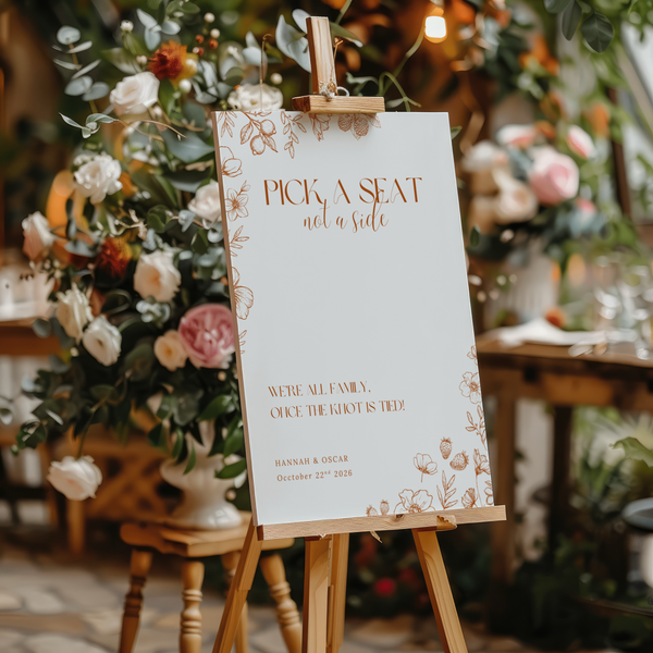 Sienna floral pick a seat not a side wedding sign with terracotta botanical sketches and elegant boho typography