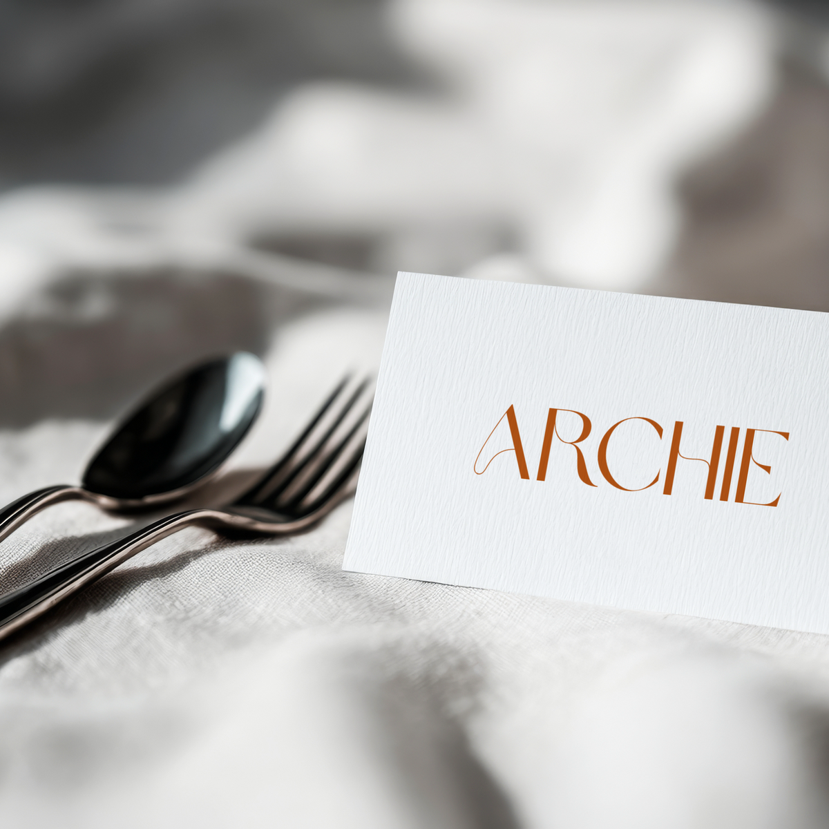 Sienna floral wedding place card with terracotta botanical sketches and elegant boho typography