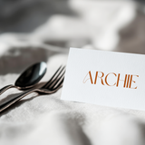 Sienna floral wedding place card with terracotta botanical sketches and elegant boho typography