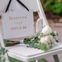 Sienna floral reserved in memory wedding chair sign with terracotta botanical sketches and elegant boho typography