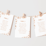 Sienna floral wedding seating plan cards with terracotta botanical sketches and elegant boho typography