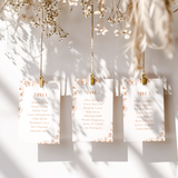 Sienna floral wedding seating plan cards with terracotta botanical sketches and elegant boho typography