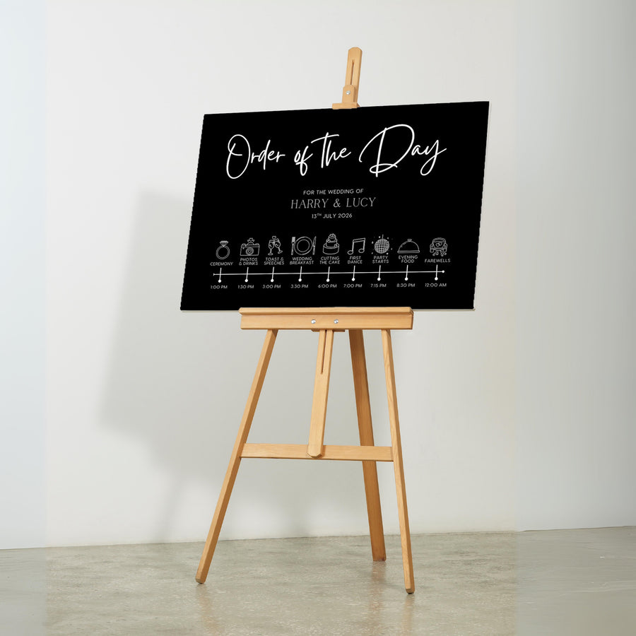 Black order of the day sign customised. A timeless and chic black wedding board, featuring crisp and sophisticated white text.