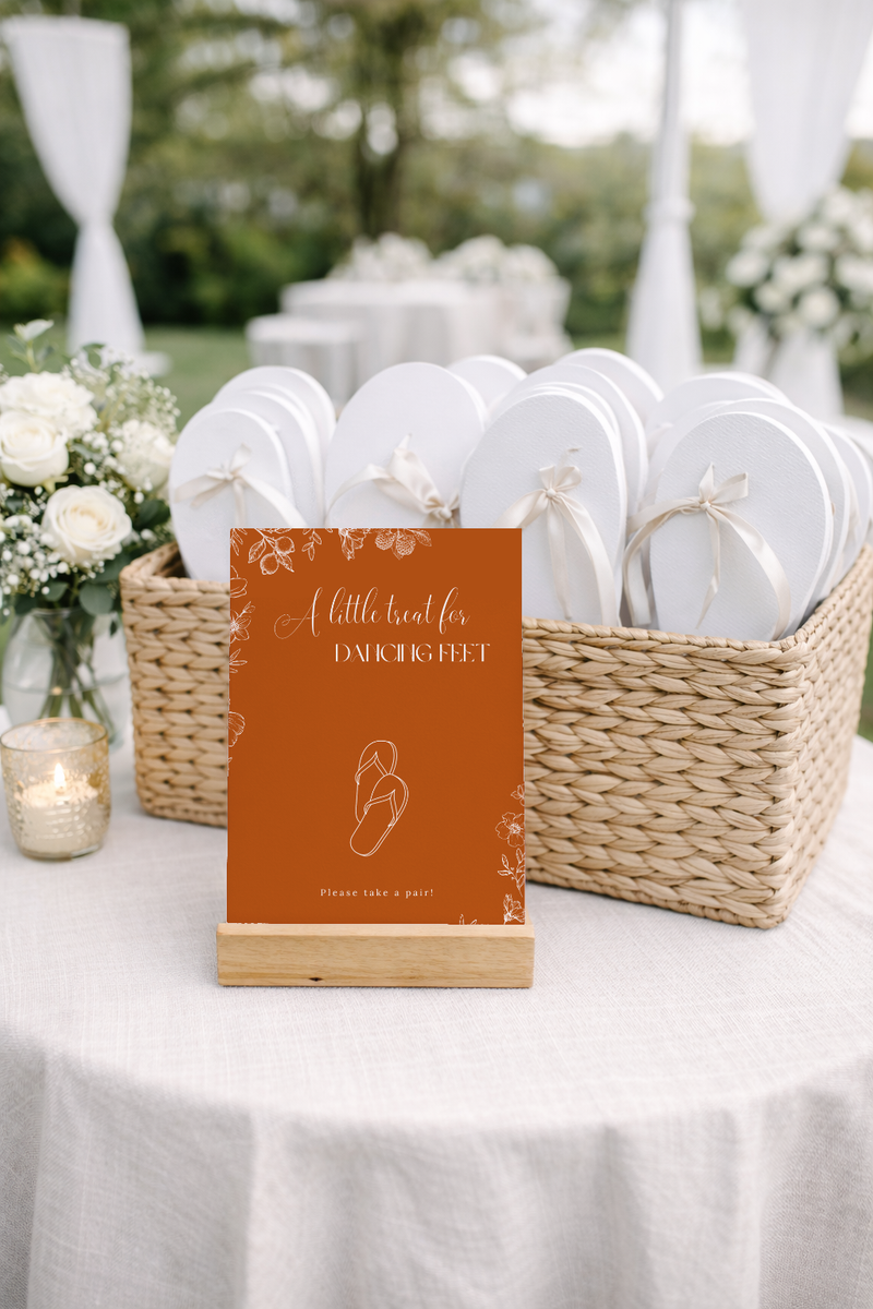 Toasted Amber wedding flip flops sign with burnt orange background and white botanical line art