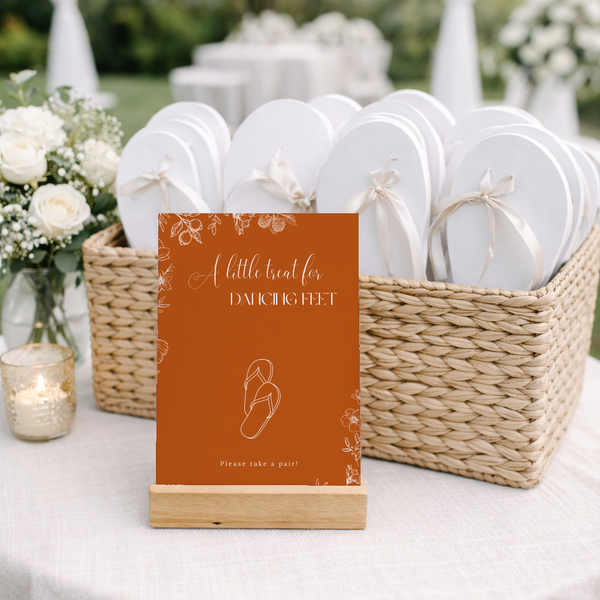 Toasted Amber wedding flip flops sign with burnt orange background and white botanical line art