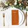 Toasted Amber wedding table number card with burnt orange background and white botanical line art