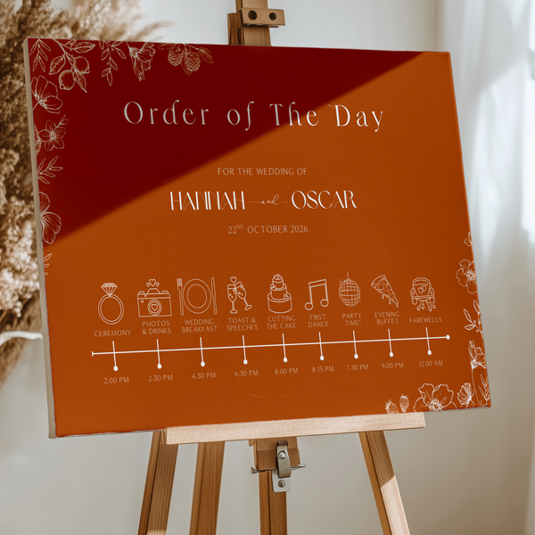 Toasted Amber wedding order of the day sign with burnt orange background and white botanical line art