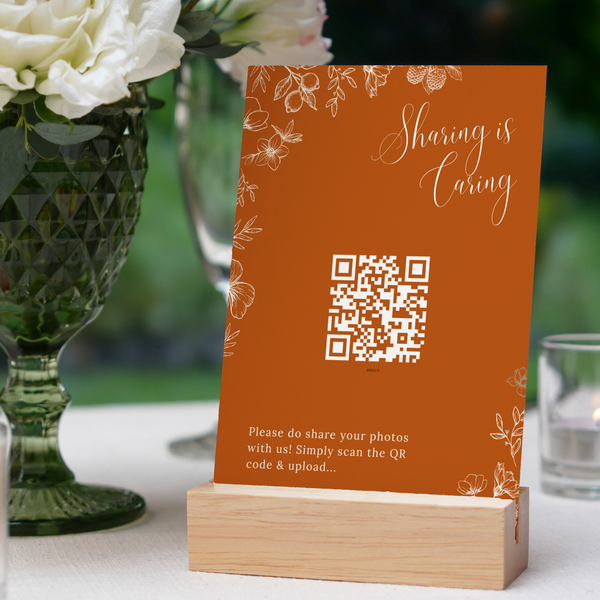 Toasted Amber photo sharing QR code wedding sign with burnt orange background and white botanical line art